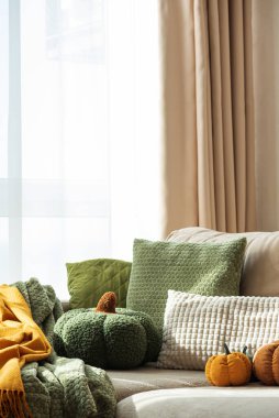 Autumn Sofa Styling with Textured Pillows, Fabric Pumpkins, and Cozy Blankets