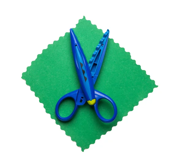 Open scissors for kids on colored paper isolated on white background — Stock Photo, Image