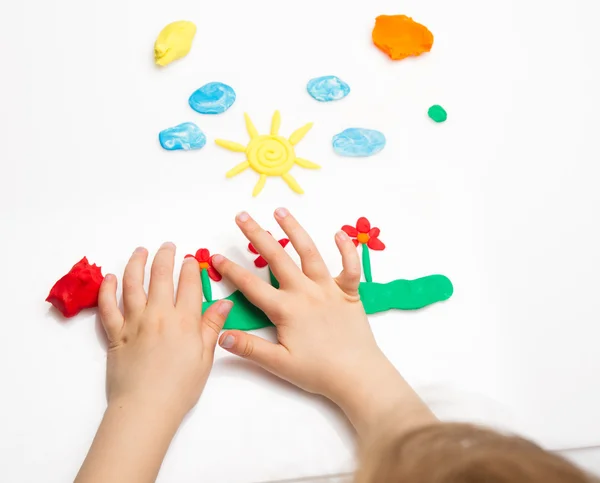 Child hands  with colorful clay — Stock Photo, Image