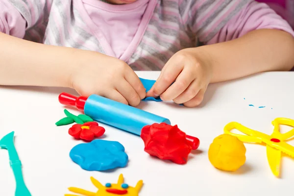 Child hands  with colorful clay — Stock Photo, Image