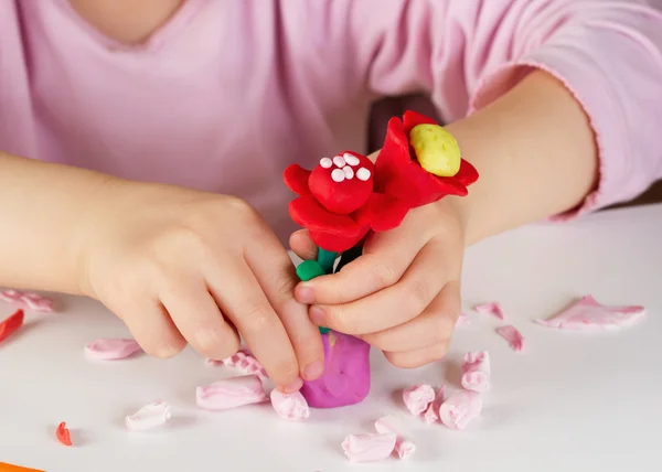 Child hands  with colorful clay — Stock Photo, Image