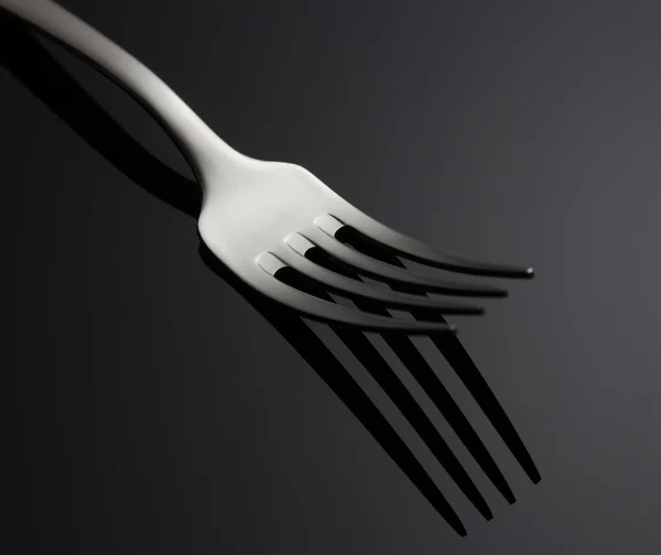 Fork on black background — Stock Photo, Image