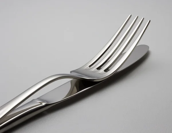 Cutlery on a plate — Stock Photo, Image