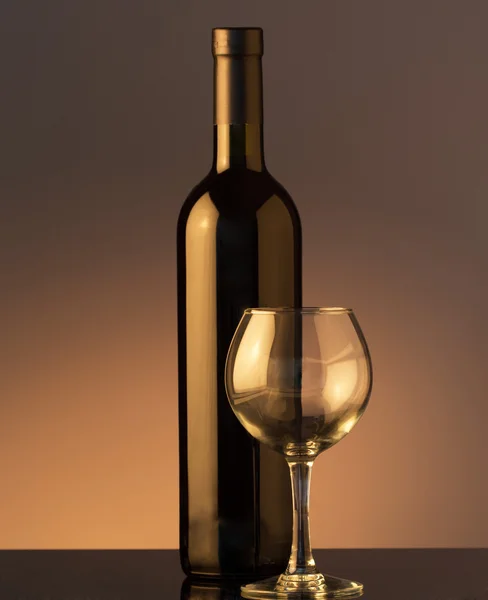 A glass and bottle of red wine — Stock Photo, Image