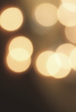 Karanlık bir arka plan karşı soyut dairesel bokeh 