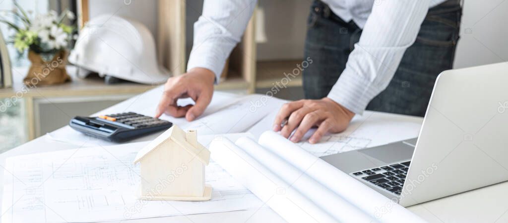 Construction engineering or architect hands working on blueprint inspection in workplace, while checking information drawing and sketching for architecture project working.