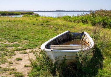 Different vacation impressions from denmark west coast with lighthouse, boats, dunes, footpath, windmills