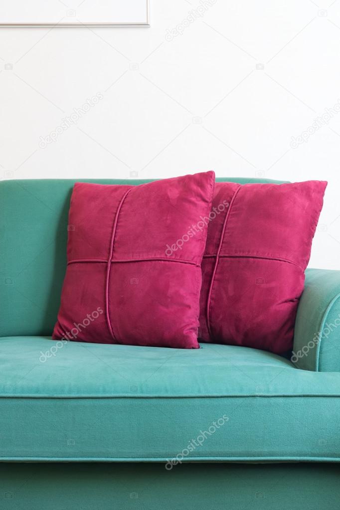 Green sofa and red backrest 