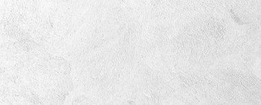 Beton duvar panoraması pürüzsüz çizgilerle beyaza boyanmış.