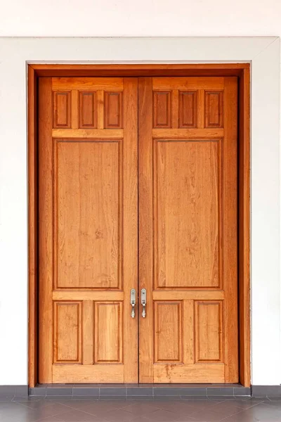 Large teak wood doors light brown entrance to the meeting room