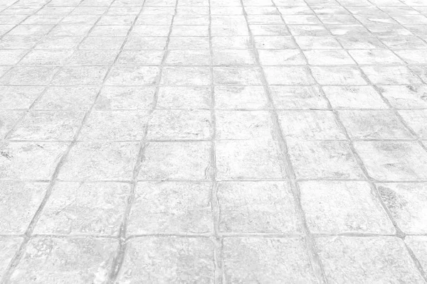 パースペクティブビューモノトーンストリートロードのための地面に灰色のレンガ造りの石畳 — ストック写真
