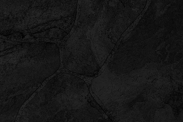 Dark grey black slate background or texture. Black granite slabs background