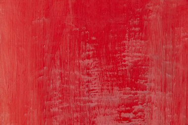 Kaba yüzey dokusu ve arkaplanı pürüzsüz olan klasik kırmızı beton duvar.