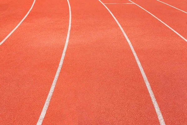 The curved lane in running track or athlete track in stadium. Running track is a rubberized artificial running surface for track and field athletics