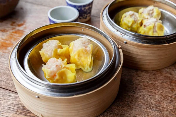 Chinese breakfast dumplings stuffed with crab in a wooden container
