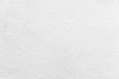 Eski tarz desenli ve arka planda pürüzsüz beyaz boyanmış beton duvar