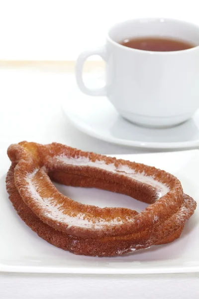 Donut with sugar and  tea — Stock Photo, Image