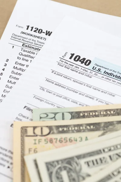 Income Tax Documents and dollars — Stock Photo, Image