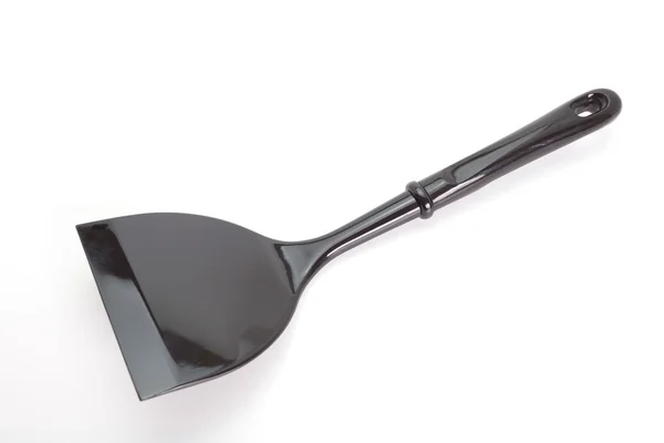 Чёрная пластиковая лопата — стоковое фото