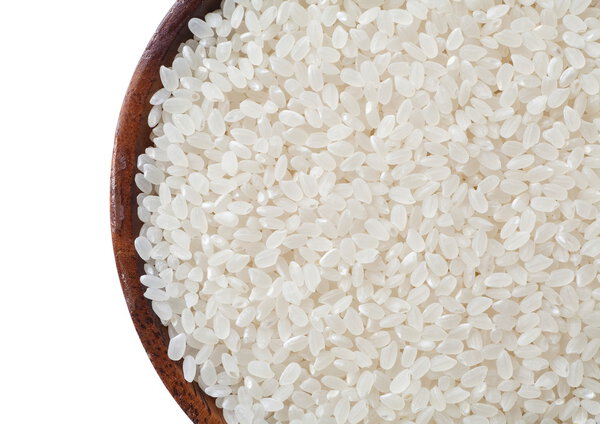 White Dry Uncooked Rice heap in bowl