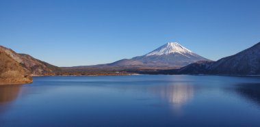 Mountain Fuji and Achi lake in winter season clipart