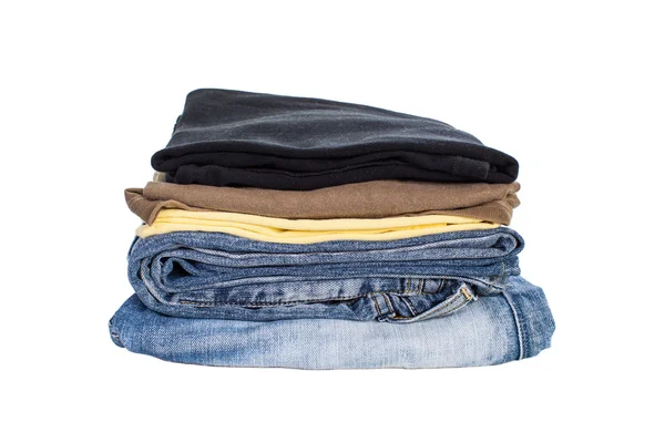 Pila di camicie di cotone e jeans — Foto Stock