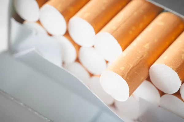 Pile of cigarettes on white — Stock Photo, Image