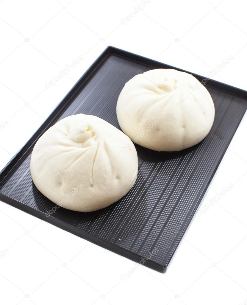 chinese steamed buns on white