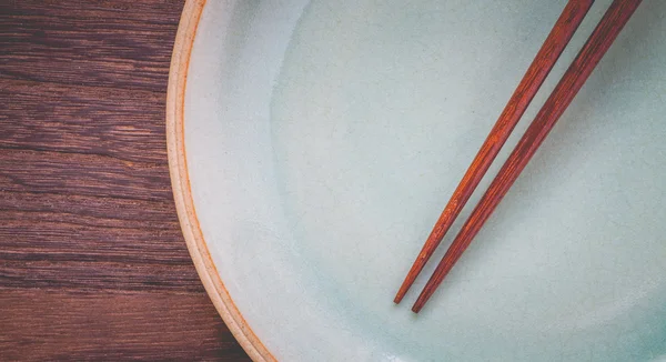 Brown chopsticks plate — Stock fotografie