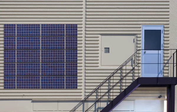 Solar panel on factory concrete wall — Stock Photo, Image