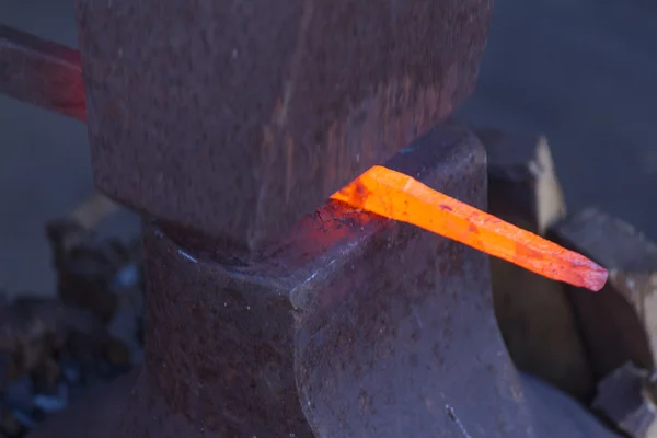 Pedra e um ferro quente — Fotografia de Stock