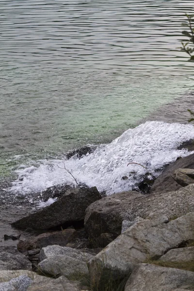 Waterfall on lake — Stock Photo, Image