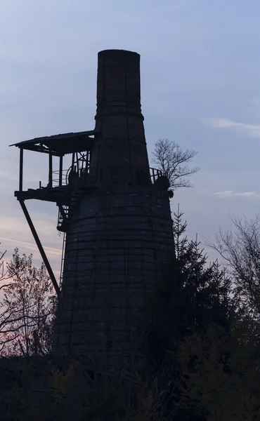 Old furnace at sunset — Stock Photo, Image