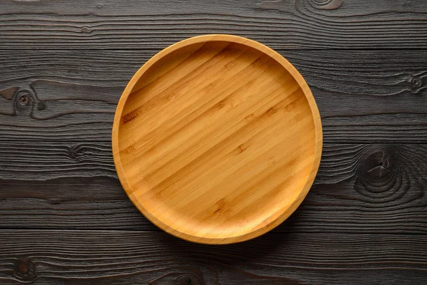 bamboo plate on wooden background top view