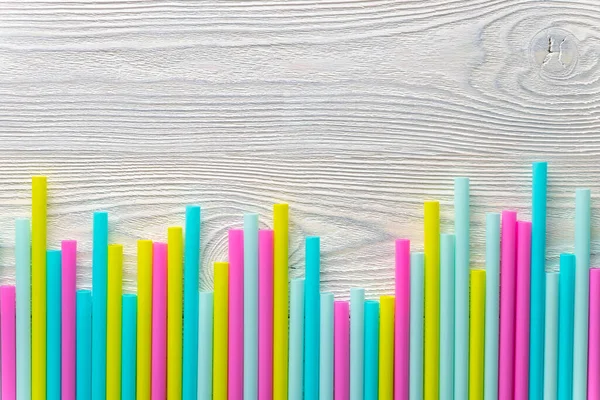 abstract background of wood and cocktail tubes
