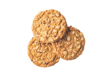 Beyaz arkaplanda farklı tohumlara sahip yulaf ezmeli kurabiyeler, üst görünüm