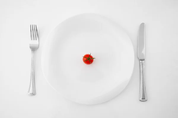 Tomate sur une assiette Images De Stock Libres De Droits