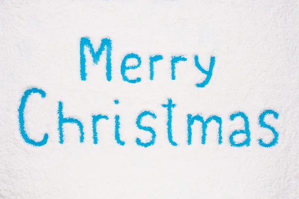 Merry Christmas painted on frozen window — Stock Photo, Image