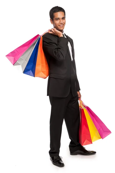 Joven inteligente con bolsas de compras . —  Fotos de Stock