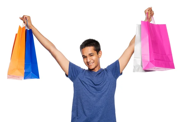 Hombre joven de raza mixta con coloridas bolsas de compras . —  Fotos de Stock