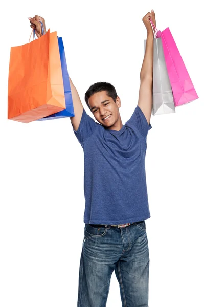 Joven feliz con bolsas de compras —  Fotos de Stock