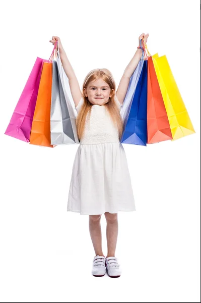 Eccitato giovane acquirente con grandi borse colorate shopping . — Foto Stock