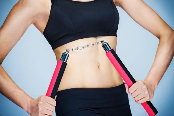 Nunchaku allenamento ragazza Foto Stock