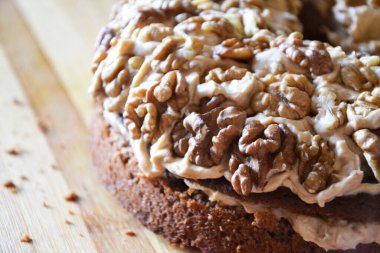 Sweet tasty walnut cake with caramel cream selective focus