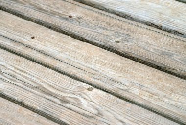 Arka bahçe güvertesi eskimeye ve yıpranmaya başladı ve iyi bir kaplama kullanılabilir. Hafif bir bokeh etkisi ile güzel bir doku ya da arka plan oluşturur.