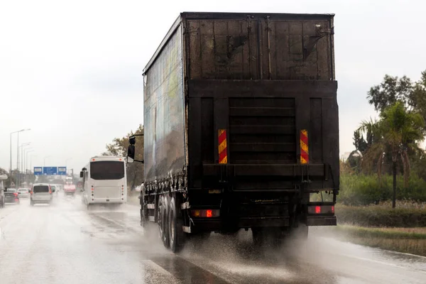 truck moving fast in the rain in Turkey