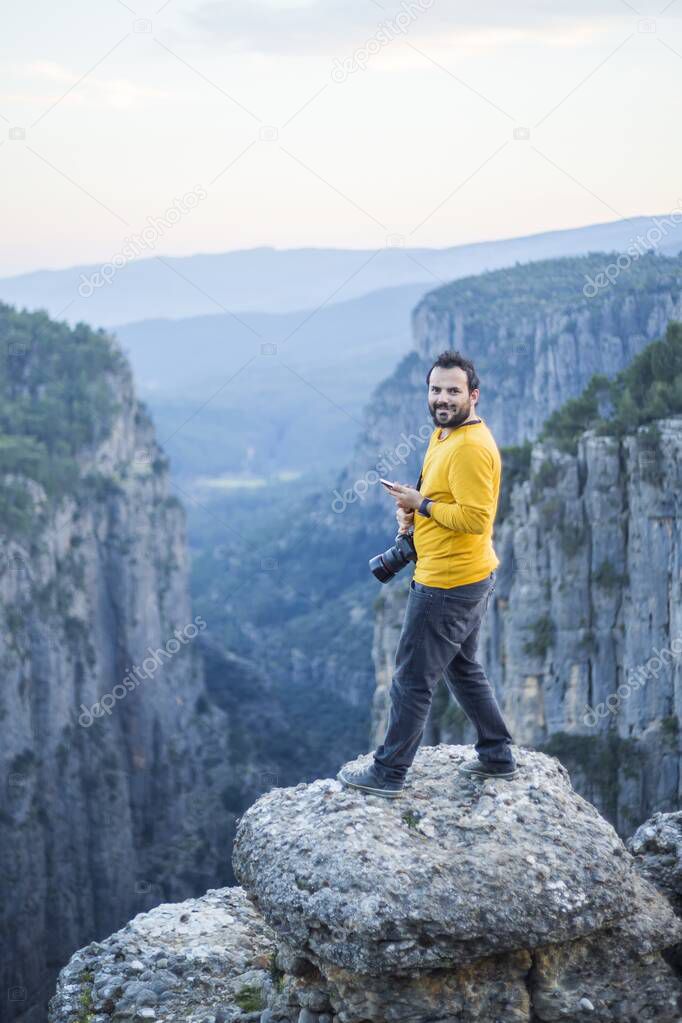 A photographer on the cliffs in Tazi Canyon in Antalya -Turkey