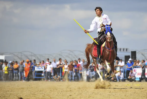 Turkey - equestrian sport in Istanbul, a Turkish teenager playing Javelin