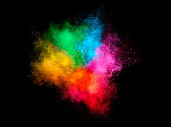 Explosão de partículas de poeira colorida isolada em fundo preto — Fotografia de Stock