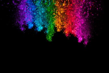 Falling colored powder isolated on black background clipart